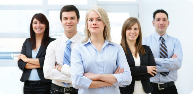 A group of corporate employees posing for a photograph